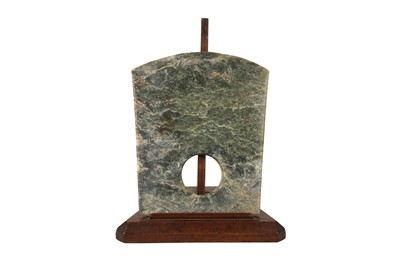 Lot 570 - A CHINESE CELADON JADE AXE HEAD.