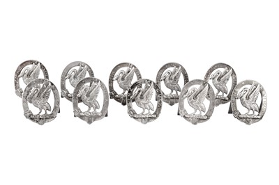 Lot 82 - A set of ten Victorian sterling silver place card holders, four London 1882 by Edward H Stockwell and six Birmingham 1883 by James Fenton