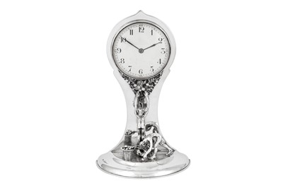 Lot 510 - A George V sterling silver figural mantle clock, Birmingham 1913 by William Hair Haseler