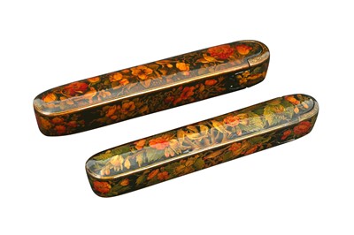 Lot 228 - TWO LACQUERED PAPIER-MÂCHÉ PEN CASES (QALAMDAN) WITH THE GOL-O-BOLBOL MOTIF