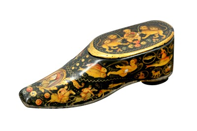 Lot 242 - A SMALL QAJAR LACQUERED PAPIER-MÂCHÉ SHOE-SHAPED BOX