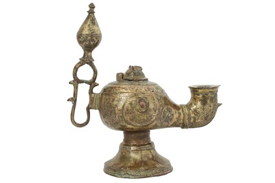 Lot 102 - A KHORASAN-REVIVAL COPPER-INLAID BRASS OIL LAMP