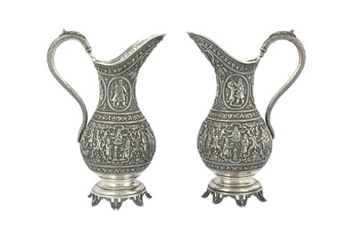 Lot 136 - A PAIR OF QAJAR REPOUSSÉ SILVER VASES WITH MYTHOLOGICAL ACHAEMENID-REVIVAL SCENES