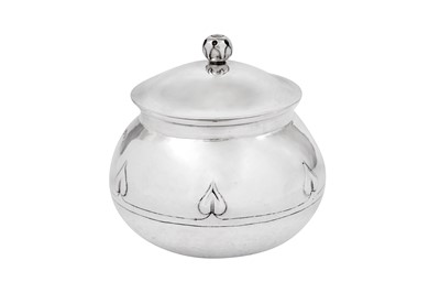 Lot 507 - An Edwardian ‘Arts and Crafts’ sterling silver tea caddy, Birmingham 1909 by Albert Edward Jones
