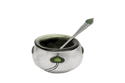 Lot 502 - An Edwardian ‘Arts and Crafts’ sterling silver and enamel salt with spoon, London 1903 by George Lawrence Connell (reg. 27th April 1893)