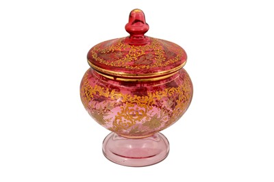 Lot 128 - A LARGE GILT AND ENAMELLED PINK GLASS LIDDED BOWL