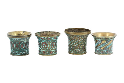 Lot 147 - FOUR GLASS BEAD AND TURQUOISE-SET BRASS QALYAN CUPS