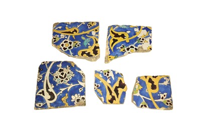 Lot 507 - FIVE FRAGMENTARY SAFAVID CUERDA SECA POTTERY TILES: THE HATAYI MOTIF