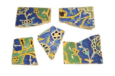 Lot 505 - FIVE FRAGMENTARY SAFAVID CUERDA SECA POTTERY TILES: THE GARDEN
