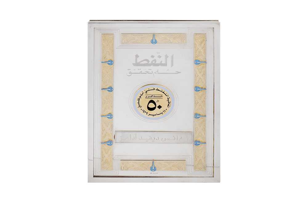 Lot 124 - An Elizabeth II sterling silver and gilt presentation book holder, London 1988 by JCB in an oval