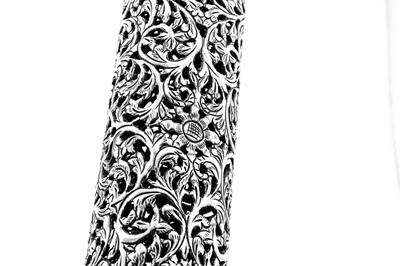 Lot 155 - An early to mid-20th century Anglo – Indian unmarked silver scroll holder, Bombay circa 1930-50
