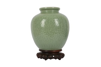 Lot 684 - A CHINESE CELADON-GLAZED 'DRAGON' JAR.