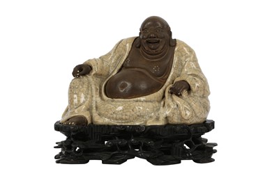 Lot 606 - A CHINESE SHIWAN FIGURE OF BUDAI HESHAN.
