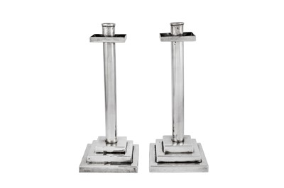 Lot 524 - A pair of Elizabeth II modernist sterling silver candlesticks, Sheffield 1967 by FHA in a heart or fruit