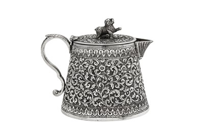 Lot 168 - A late 19th century Anglo – Indian unmarked silver lidded milk or cream jug, Cutch circa 1880