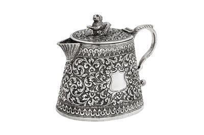 Lot 168 - A late 19th century Anglo – Indian unmarked silver lidded milk or cream jug, Cutch circa 1880