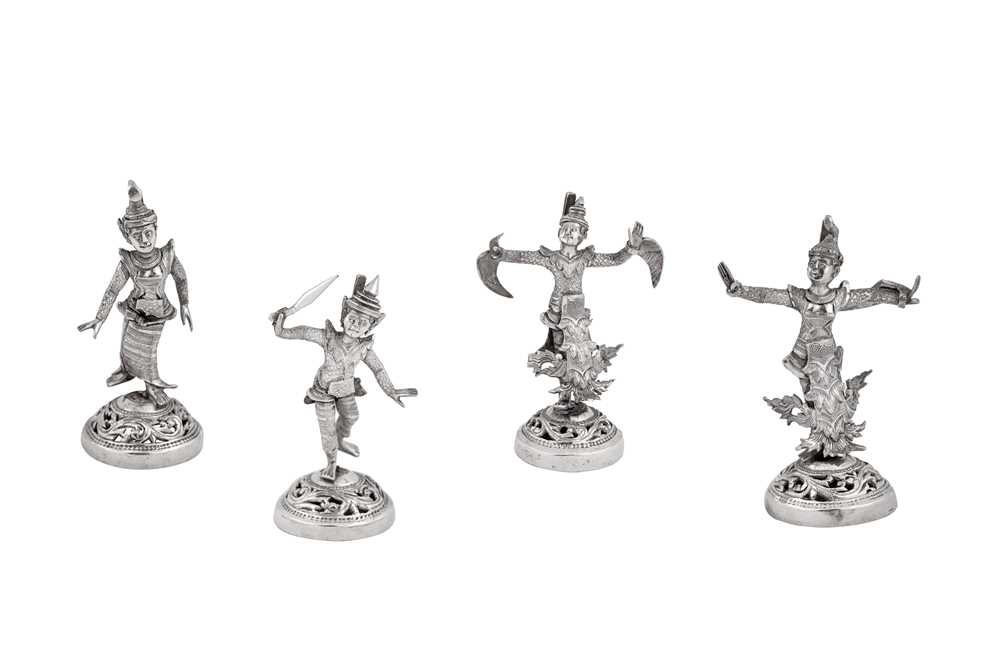 Lot 183 - A set of four mid-20th century Burmese unmarked silver menu holders, Rangoon circa 1950