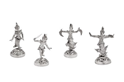 Lot 183 - A set of four mid-20th century Burmese unmarked silver menu holders, Rangoon circa 1950