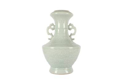 Lot 189 - A CHINESE PALE CELADON-GLAZED 'PEONIES' VASE.
