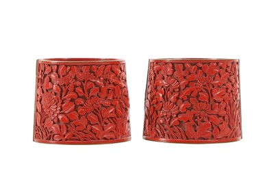 Lot 636 - A PAIR OF CHINESE CINNABAR RED LACQUER WRIST BANDS.
