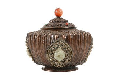 Lot 417 - A TIBETAN JADE-INSET COPPER ALLOY 'BAJIXIANG' BOX AND COVER.