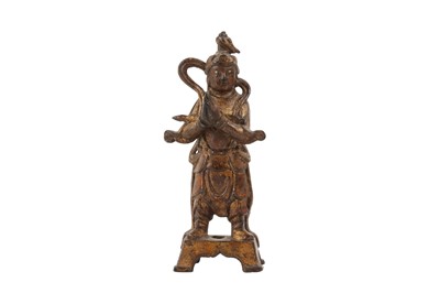 Lot 322 - A CHINESE GILT-BRONZE FIGURE OF AN ATTENDANT.