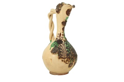 Lot 499 - A LARGE GREEN-SPLASHED WHITE-GLAZED CANAKKALE POTTERY EWER