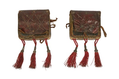 Lot 428 - TWO OTTOMAN TOOLED LEATHER CARTRIDGE CASES WITH TASSELS