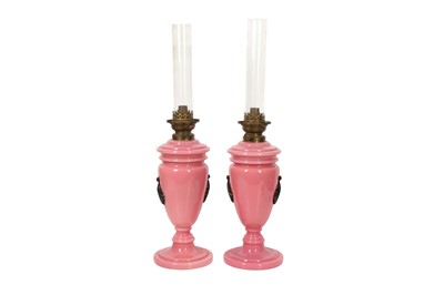 Lot 669 - A PAIR OF PINK OPALINE VASES CONVERTED INTO OIL LAMPS