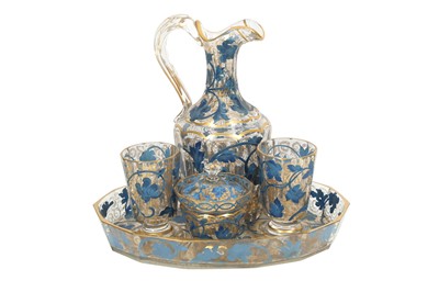 Lot 631 - A GILT AND BLUE-PAINTED TRANSPARENT GLASS DRINKING SET MADE FOR THE MIDDLE EASTERN MARKET
