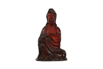 Lot 607 - A CHINESE RECOMPOSITED AMBER FIGURE OF GUANYIN.
