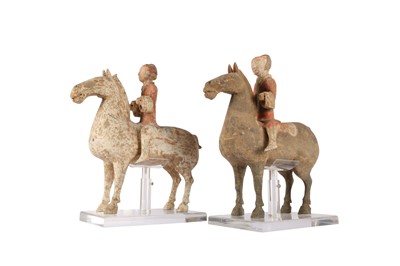 Lot 154 - TWO CHINESE POTTERY HORSES AND RIDERS.