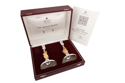 Lot 543 - A cased pair of Elizabeth II parcel gilt sterling silver commemorative candlesticks, London 1977 by Garrard and Co