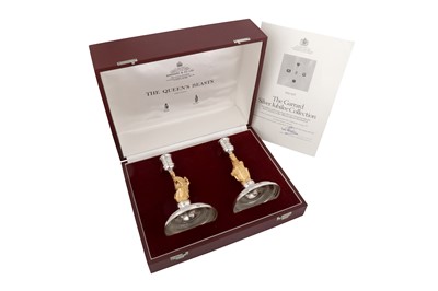 Lot 546 - A cased pair of Elizabeth II parcel gilt sterling silver commemorative candlesticks, London 1977 by Garrard and Co