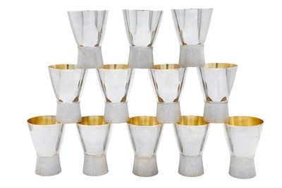 Lot 538 - A set of twelve Elizabeth II modernist sterling silver goblets, London 1984 by Brian Leslie Fuller (1939-2009)