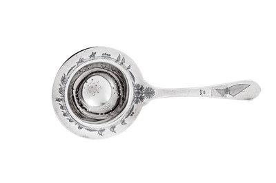 Lot 367 - An early 20th century Iraqi silver and niello tea strainer, circa 1920-30 signed Omara, Zahroon