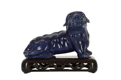 Lot 751 - A CHINESE BLUE-GLAZED LION DOG.