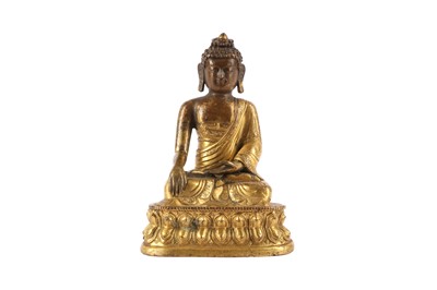Lot 174 - A CHINESE GILT-BRONZE FIGURE OF A BUDDHA SAKYAMUNI.