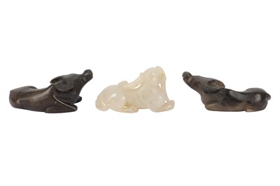 Lot 636 - A CHINESE PALE CELADON JADE CARVING OF A KYLIN, IN THE MING STYLE