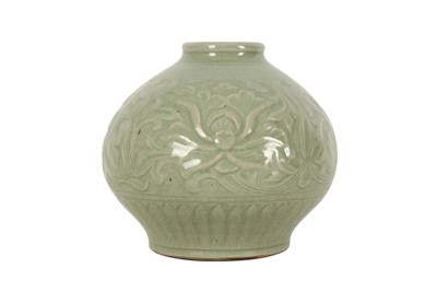 Lot 493 - A CHINESE INCISED CELADON-GLAZED JAR.