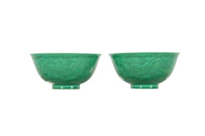 Lot 123 - A PAIR OF CHINESE INCISED GREEN-GLAZED 'DRAGON' BOWLS.