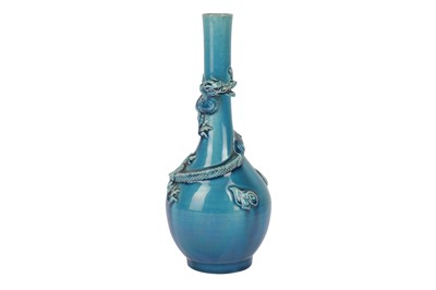 Lot 655 - A JAPANESE TURQUOISE-GLAZED 'DRAGON' BOTTLE VASE.