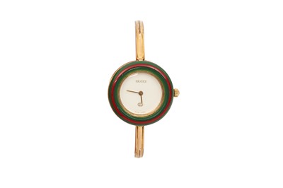 Lot 283 - Gucci Gold Interchangeable Bezel Bangle Watch