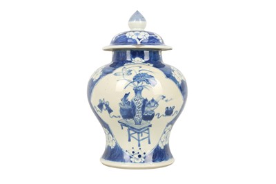 Lot 589 - A CHINESE BLUE AND WHITE BALUSTER VASE AND COVER.