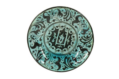 Lot 716 - A PSEUDO-KUBACHI BLACK AND TURQUOISE EARTHENWARE DISH