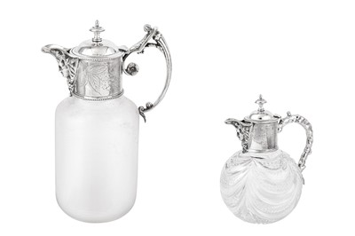 Lot 30 - AMENEDED DESCRIPTION: TWO SILVER MOUNTED GLASS CLARET JUGS