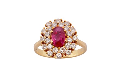 Lot 95 - A ruby and diamond cluster ring