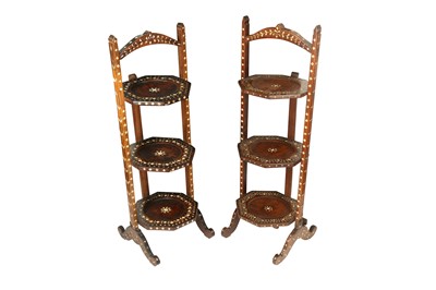 Lot 724 - λ A NEAR PAIR OF HARDWOOD IVORY-INLAID ANGLO-INDIAN TIERED TEA TRAYS
