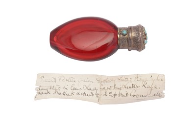 Lot 28 - A Victorian unmarked silver gilt mounted and turquoise set ruby glass scent bottle, circa 1850