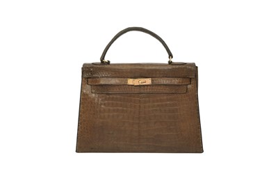 Lot 171 - λ Hermes Brown Shiny Crocodile Kelly Sellier 32